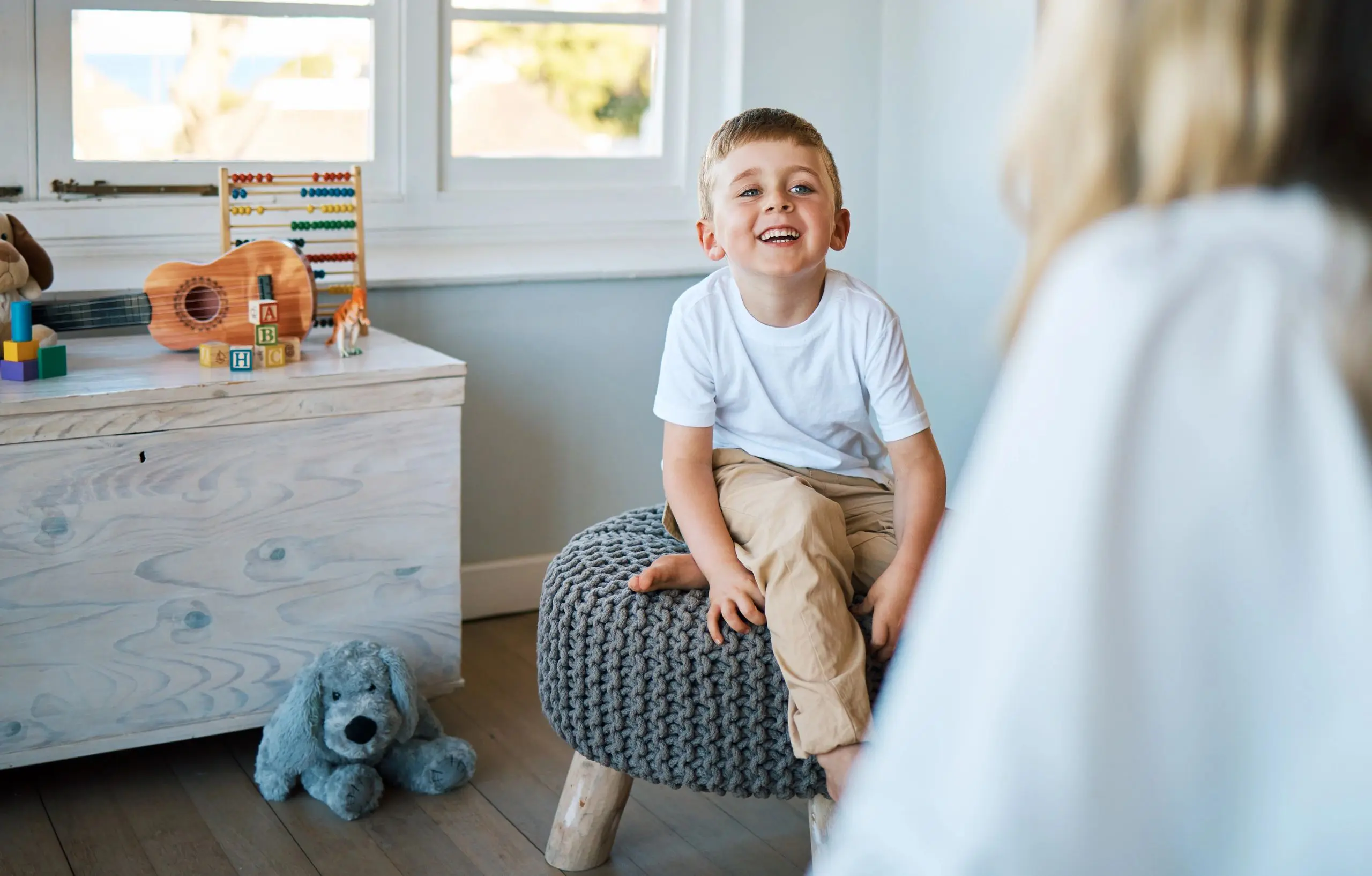 Boy sitting on a stool