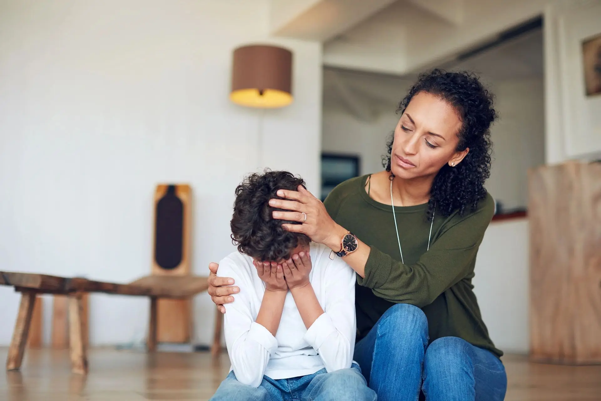 Woman comforting a sad child