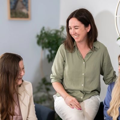 Women smiling and talking together